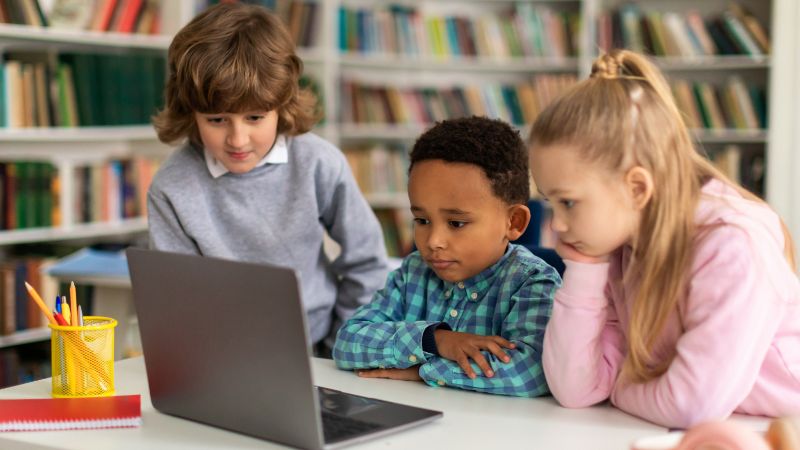 kids watching videos on laptop