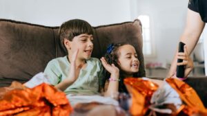 Kids using a tablet for a safe and engaging video call, highlighting secure communication apps for children.